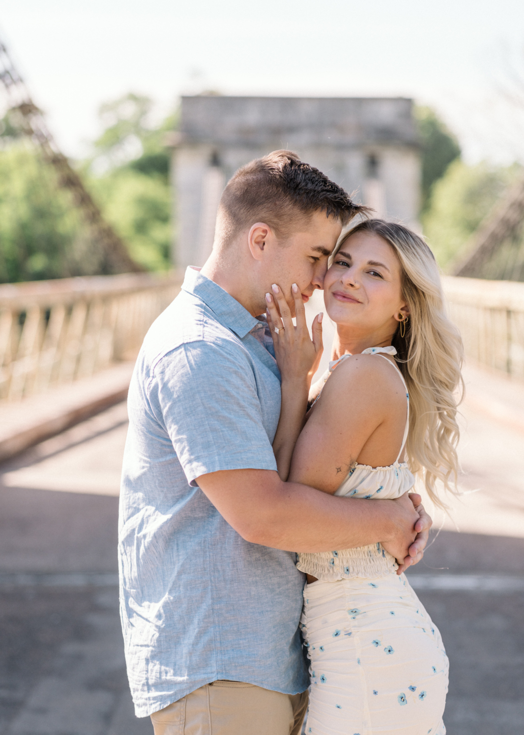 young engaged couple embrace after engagement in arles france