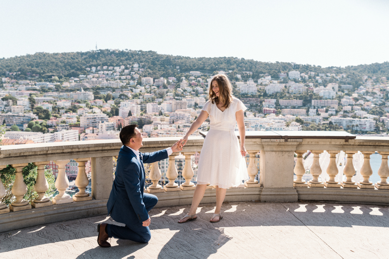 man gets on one knee in nice, france