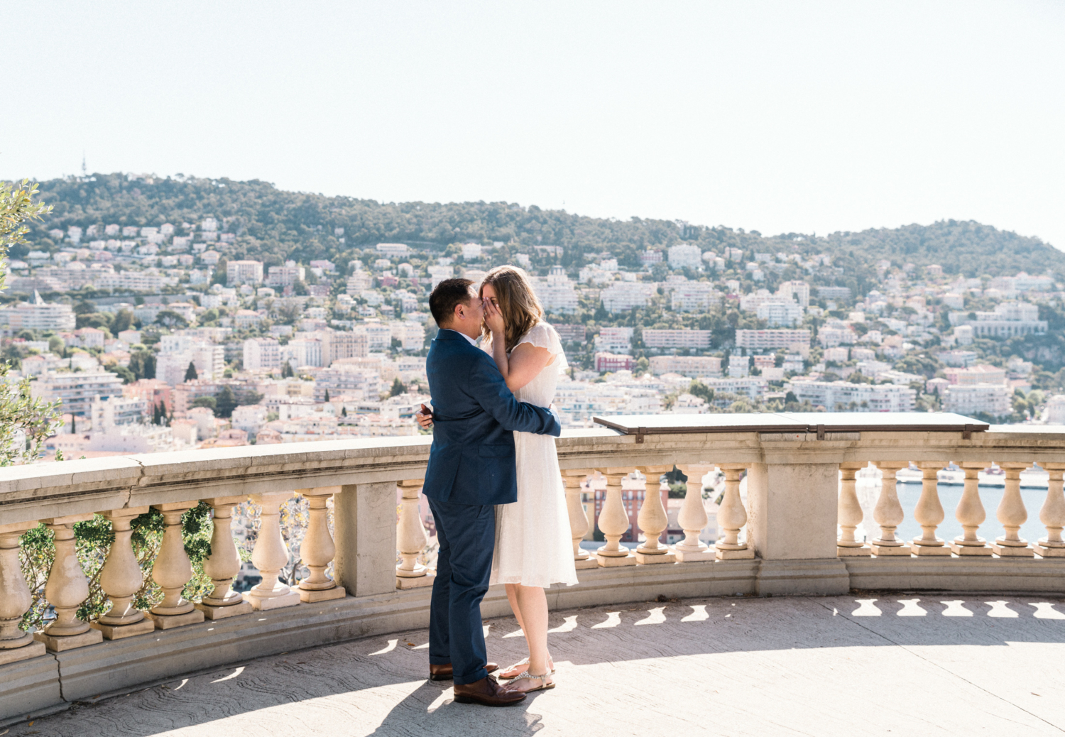woman is surprised after surprise proposal in nice, france