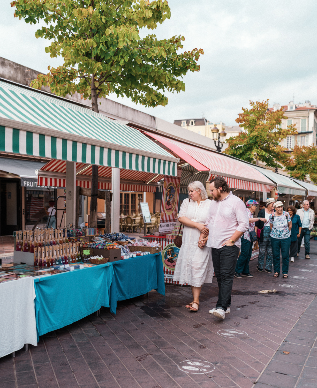 couple explore food market in nice france