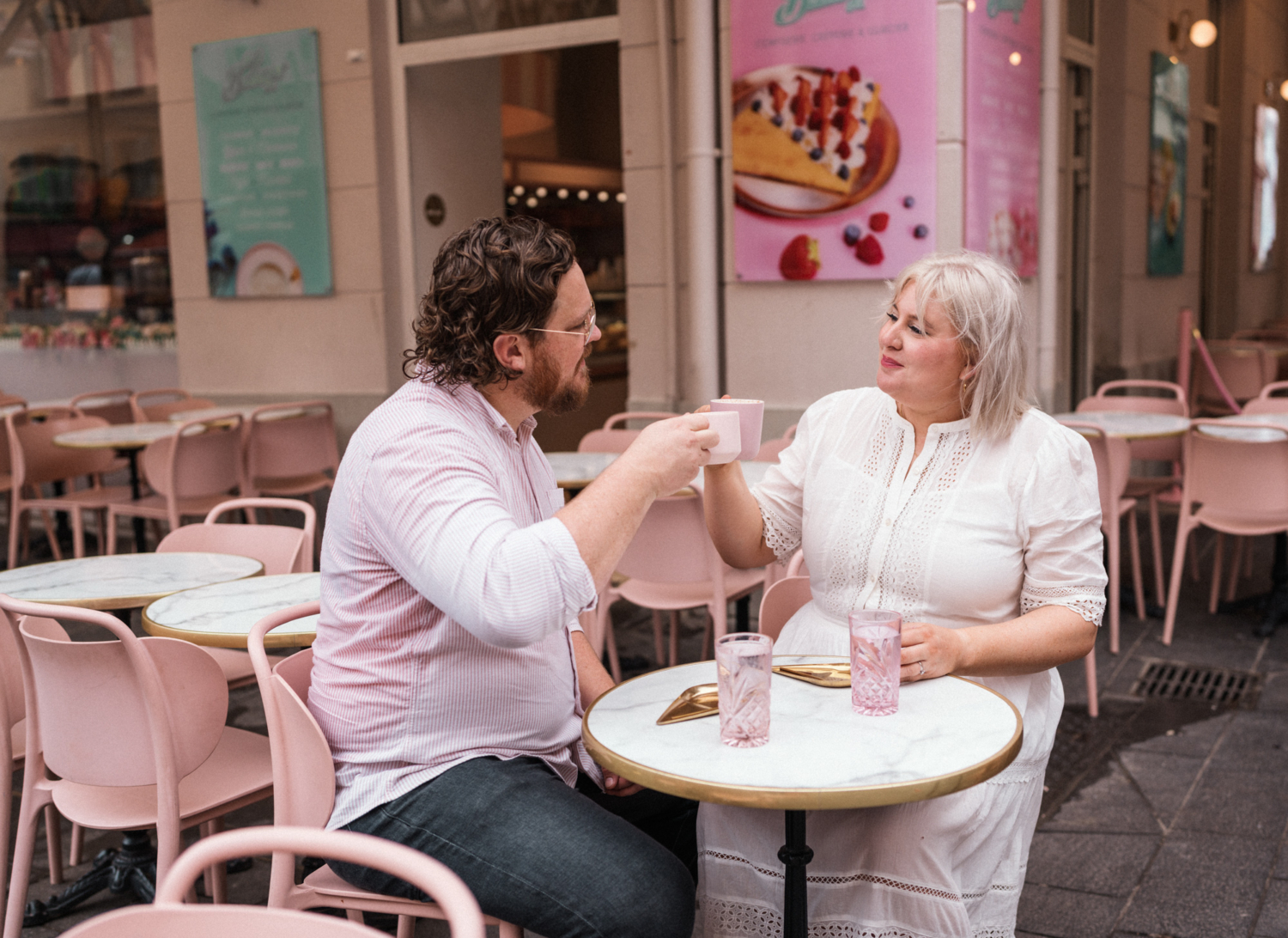 couple celebrating anniversary toast with coffee in nice france