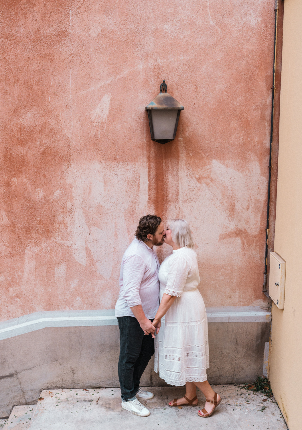 cute couple kiss under lamp post in nice france