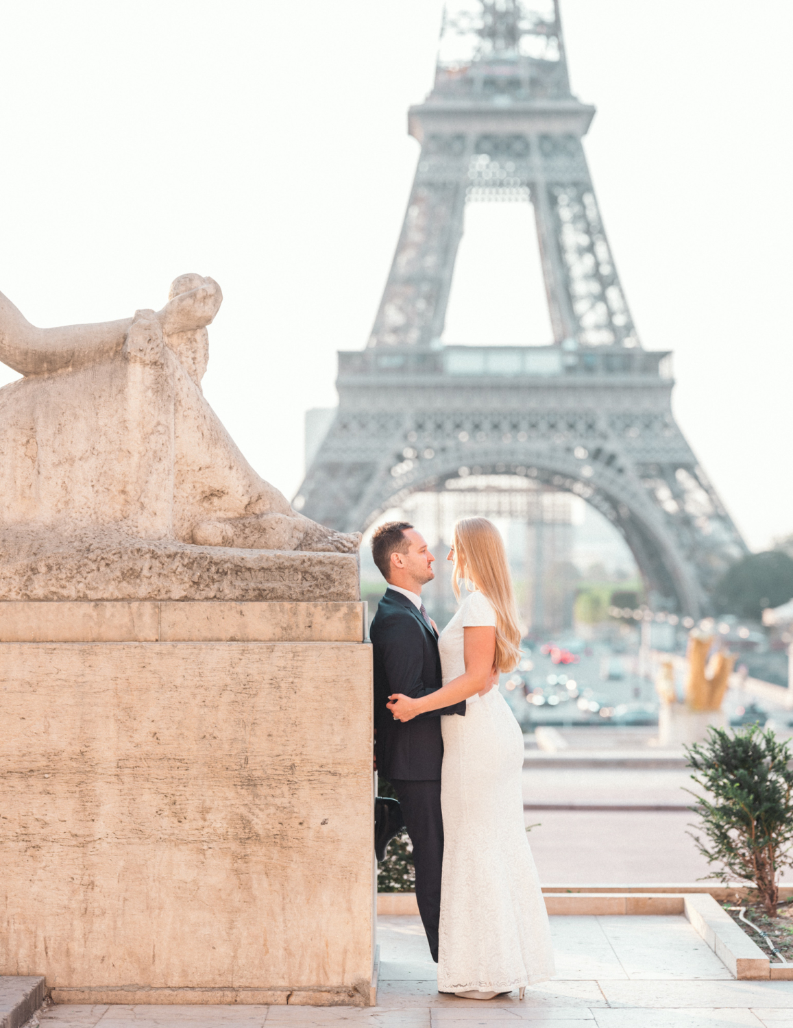 bride and groom embrace and trocadero gardens paris