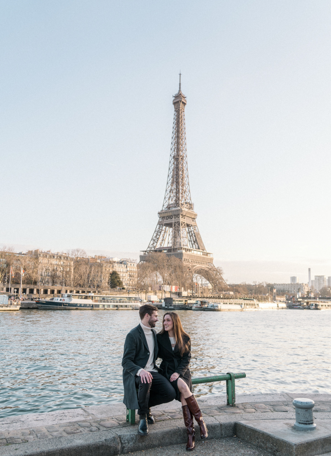 newly engaged couple pose near eiffel tower in paris