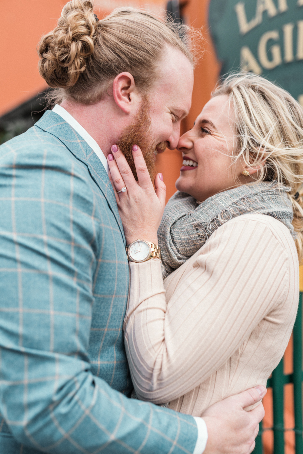 newly engaged couple embrace in montmartre in paris