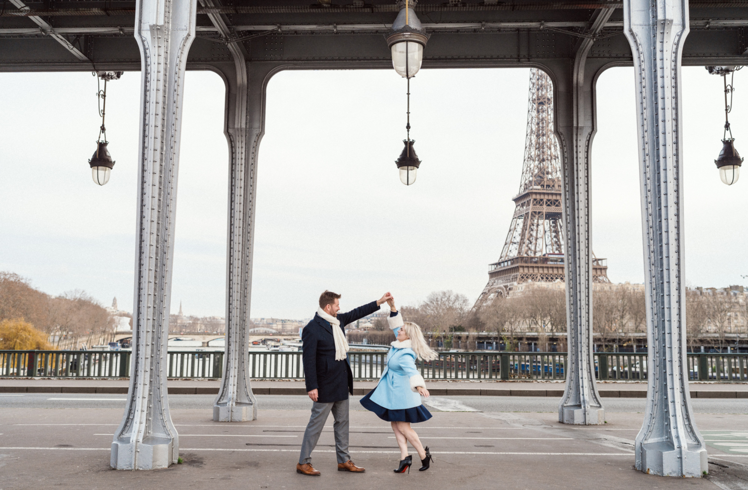 couple dance in paris with view of eiffel tower