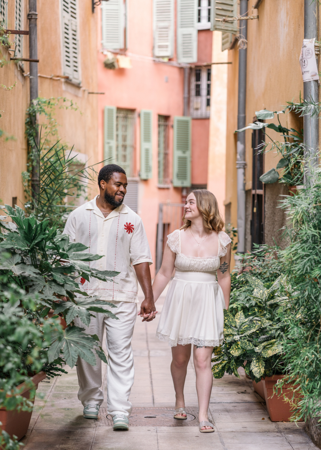 married couple walk around plants in old nice france