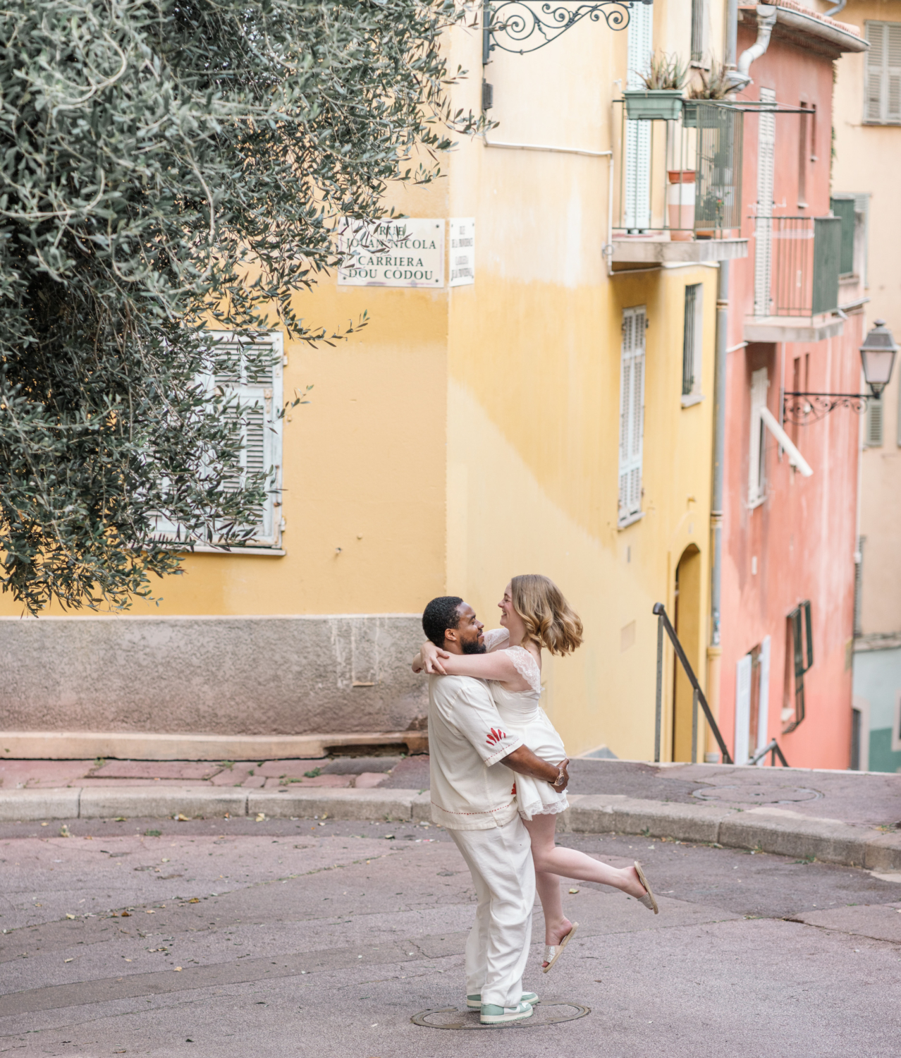 man and woman twirl in old town nice france