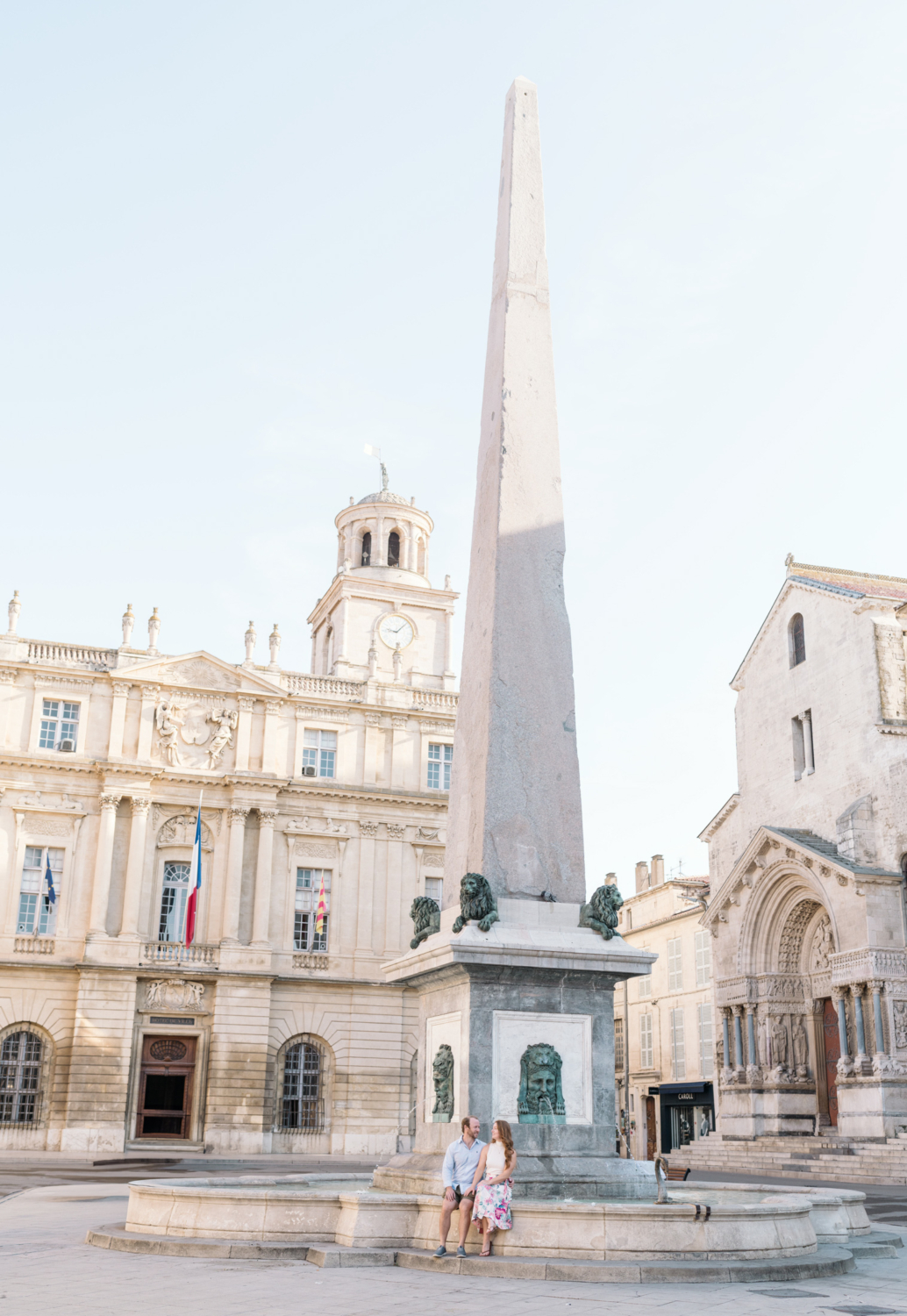 happy couple enjoy obelisk and fountain in arles france