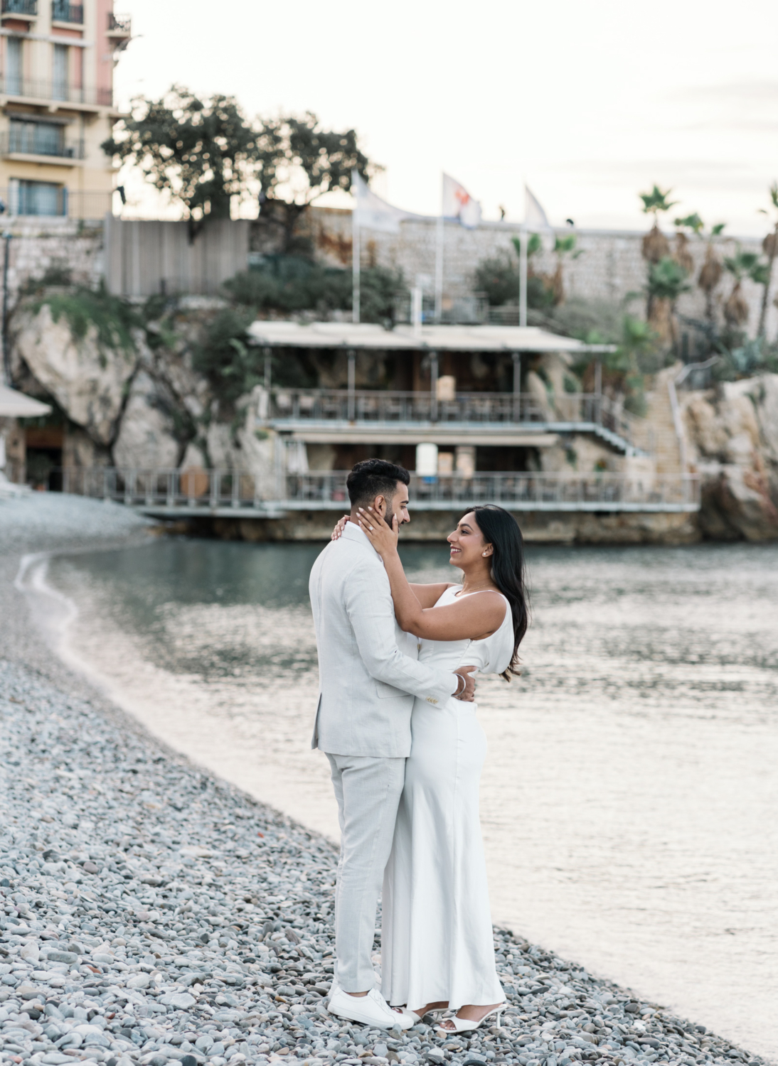 gorgeous couple embrace next to sea in nice france