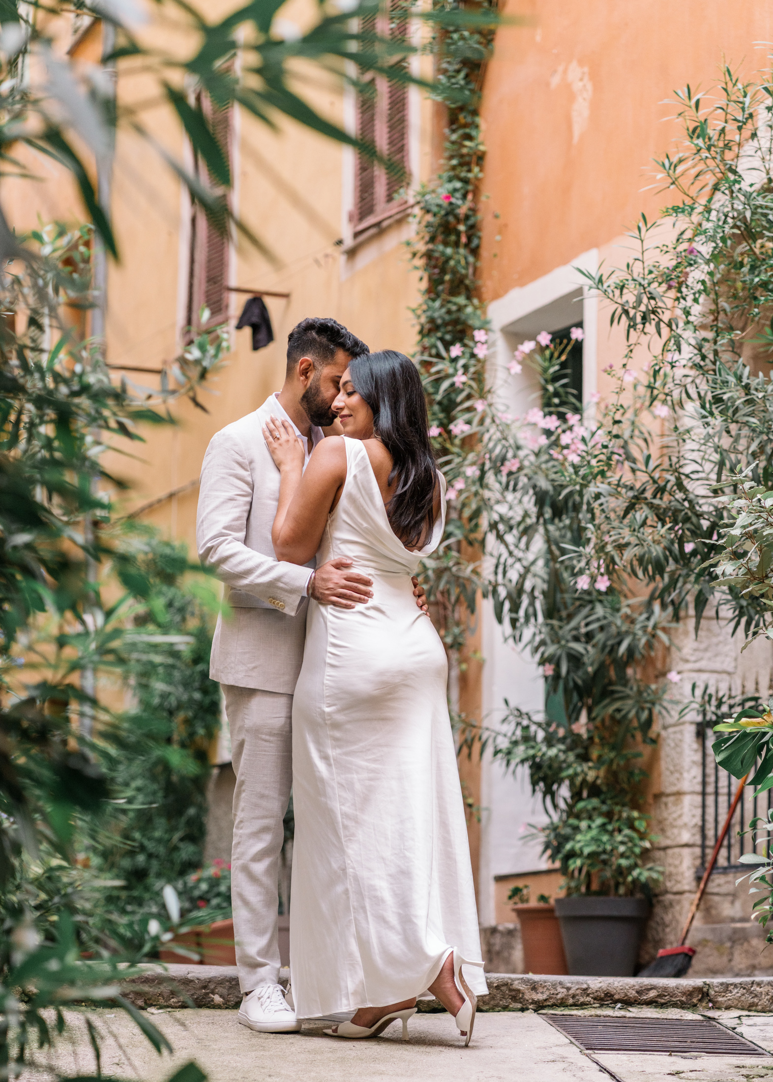 beautiful engaged couple embrace in romantic nice france