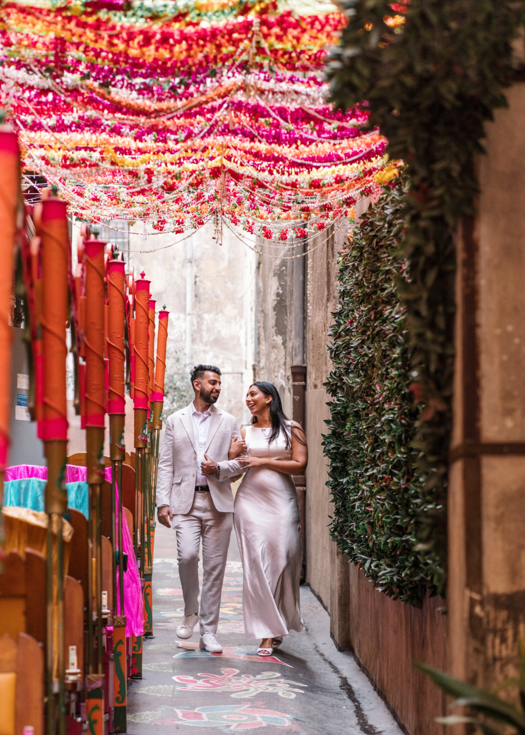 beautiful couple walk in old nice france next to indian restaurant