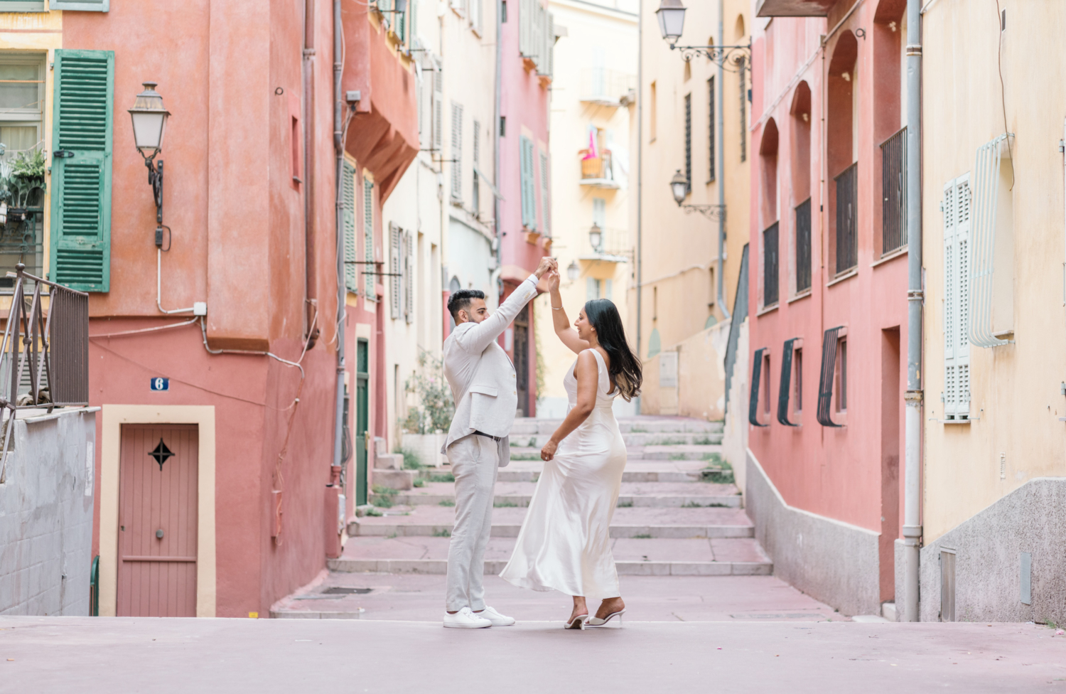 engaged indian couple dance in old town nice france