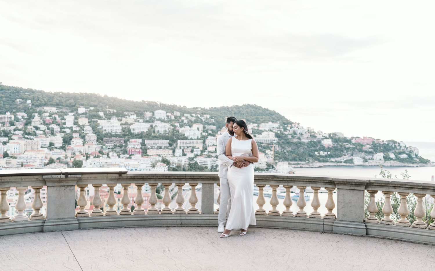 engaged couple embrace at castle hill in nice france