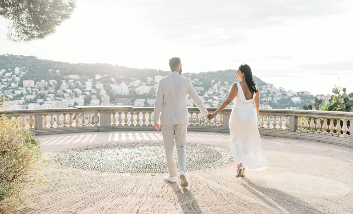 engaged couple walk toward mont boron in nice france