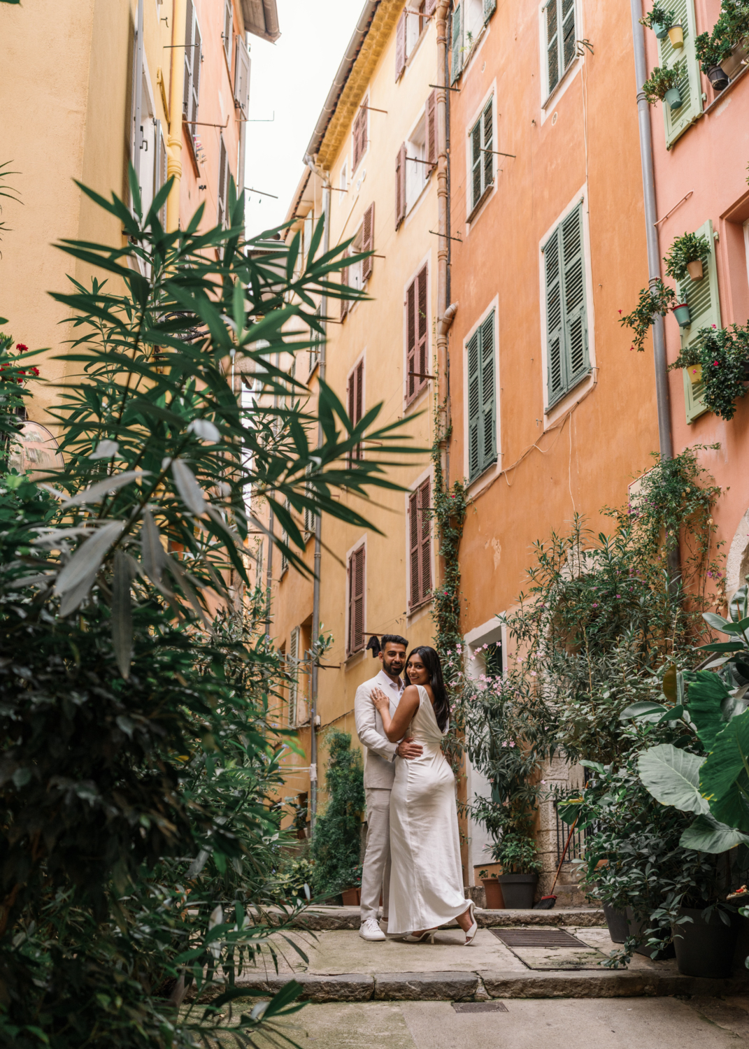 cute couple pose at engagement session in old town nice