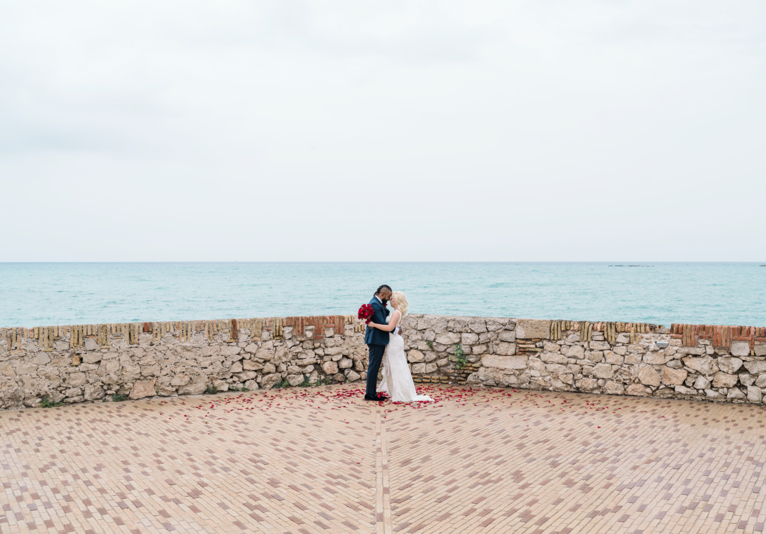 bride and groom embrace on their wedding day in antibes france