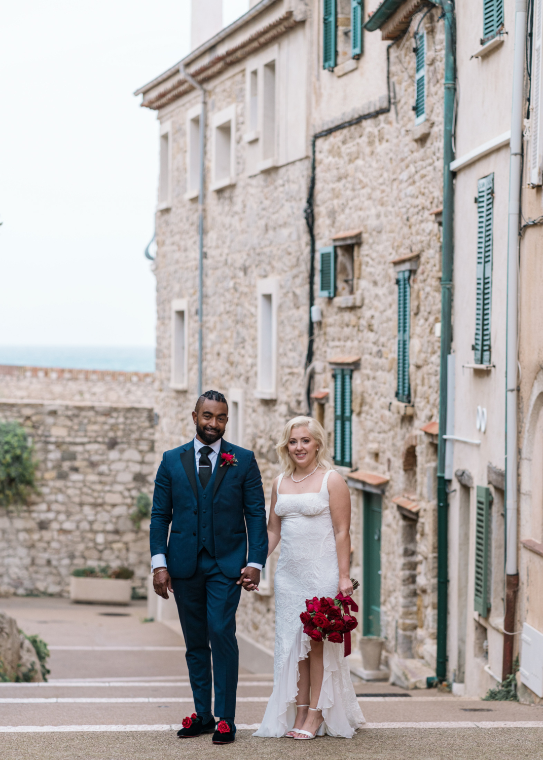 newlyweds pose in old town antibes france