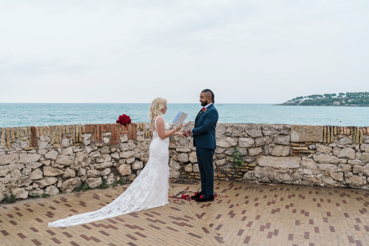 bride reads vows to groom with sea view in antibes france