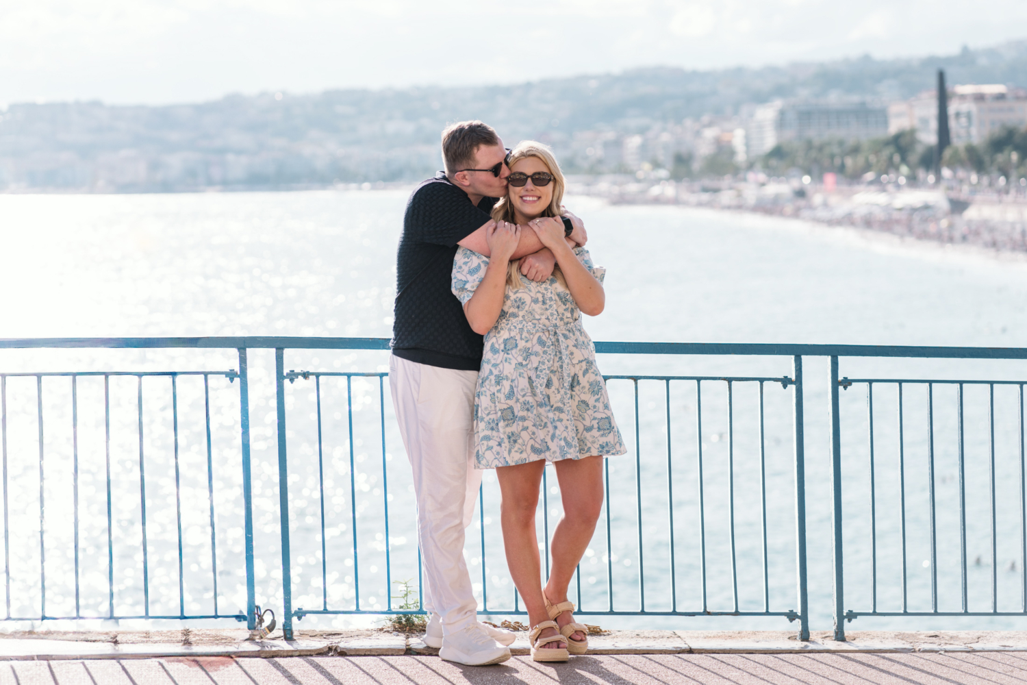 newly engaged couple pose on promenade des anglais in nice france