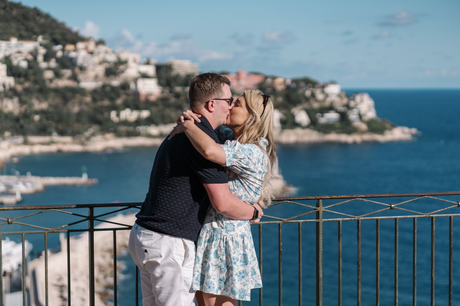 newly engaged couple kiss with view of the sea in nice france