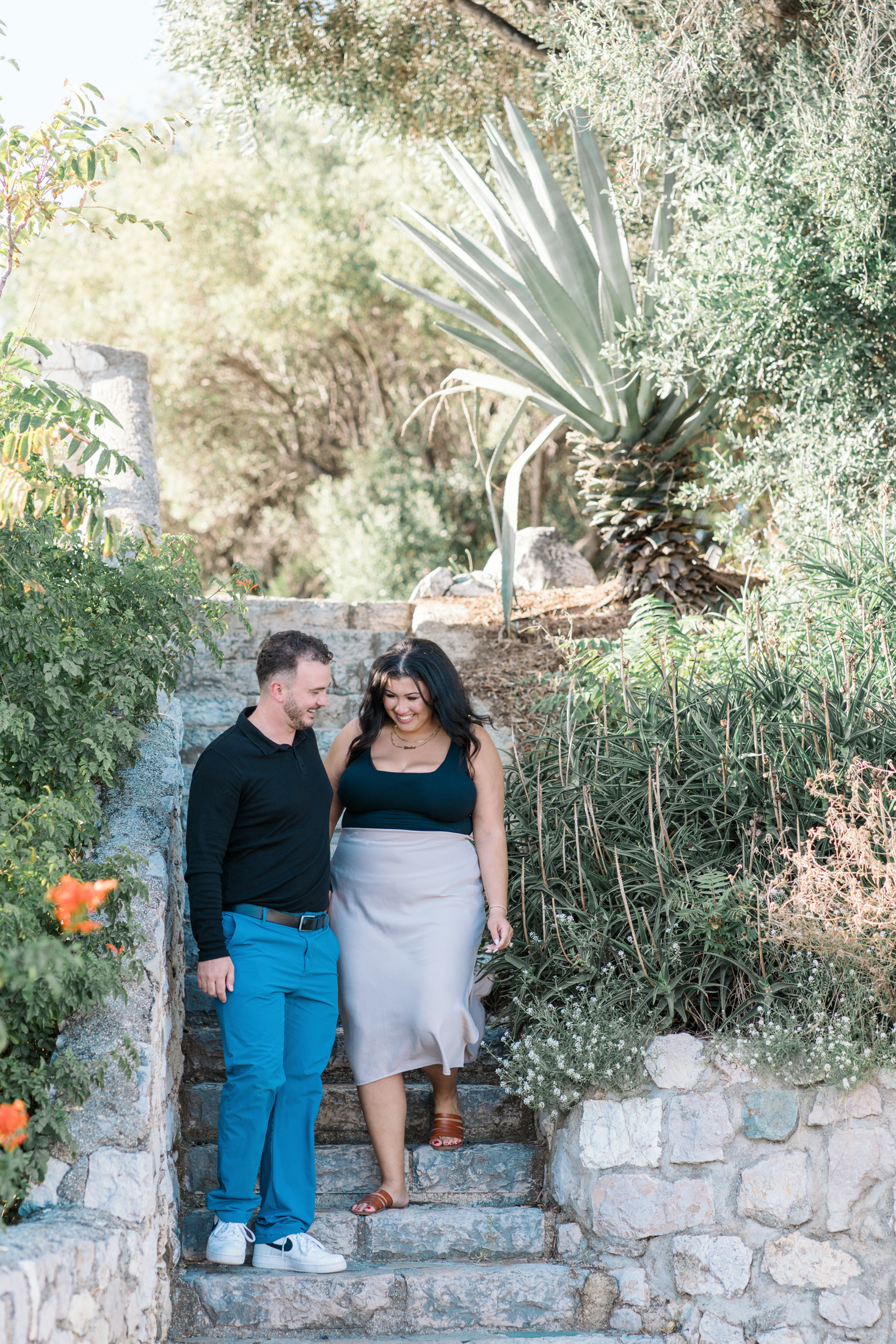 newly engaged couple walk in park in nice france