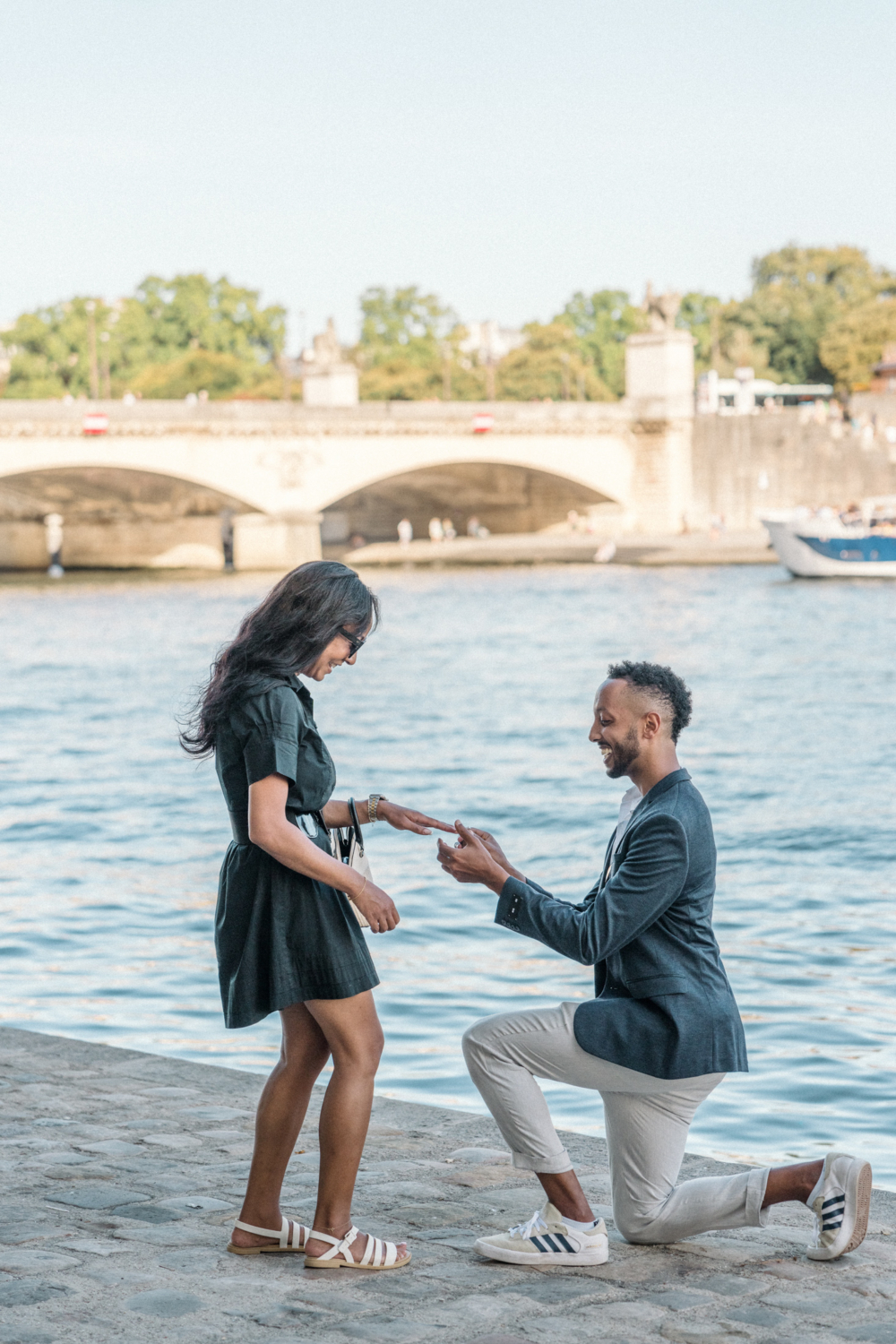 man gives engagement ring to woman in paris france