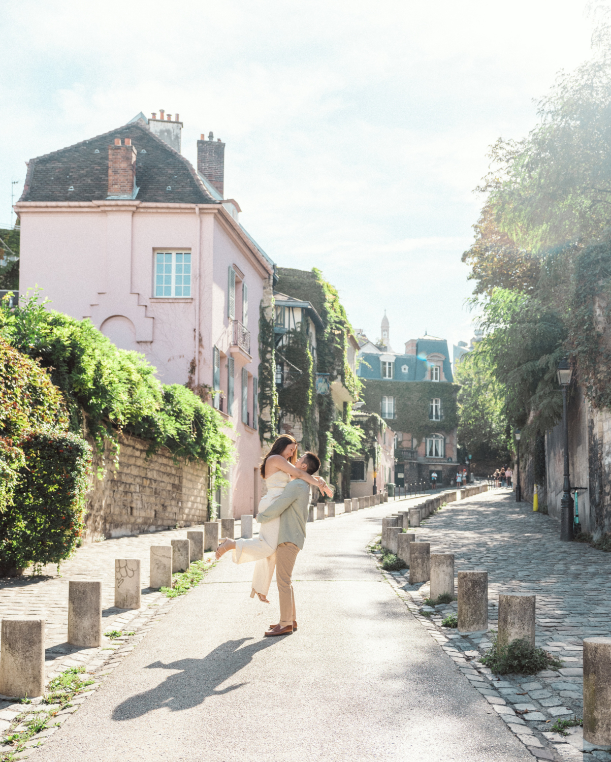 engaged couple dance in montmartre paris france