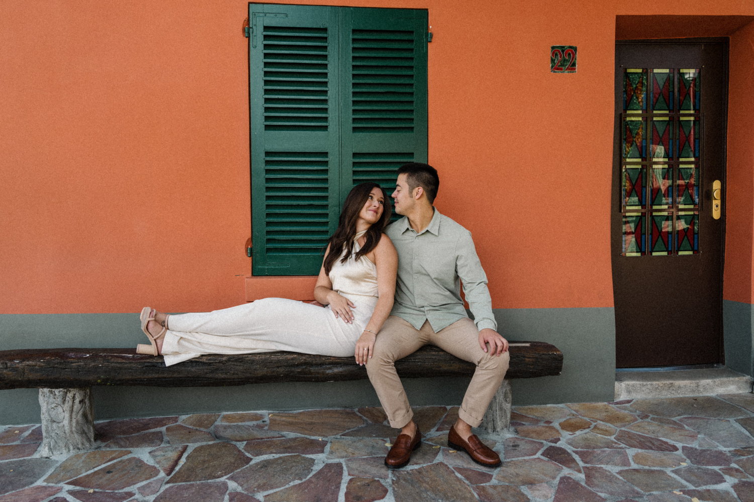 cute engaged couple sit at the lapin agile cabaret in paris