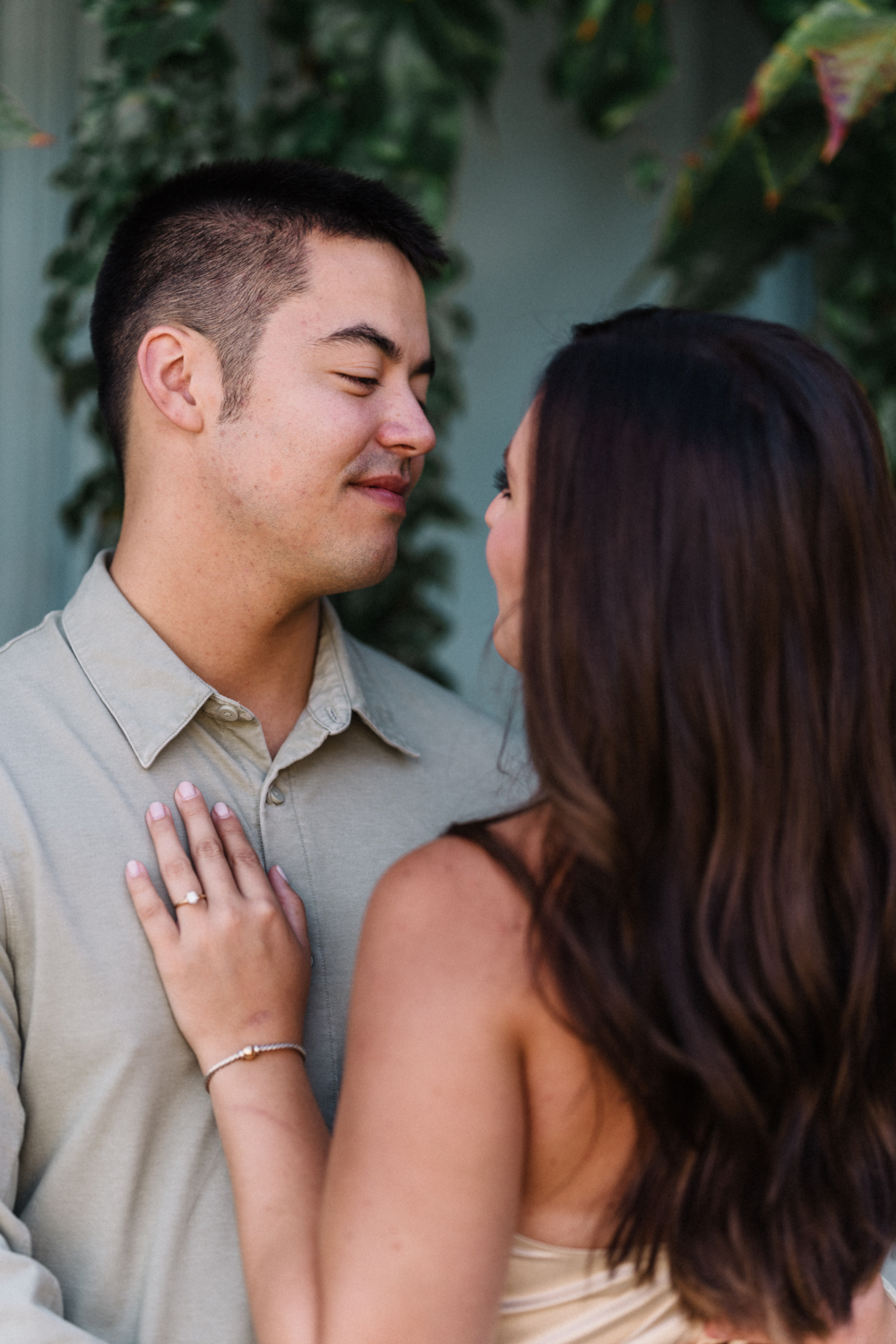 man looks lovingly at his fiancee in paris