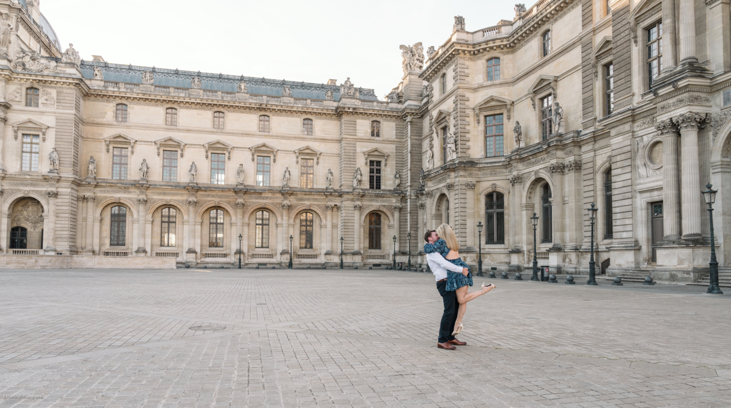 young newly engaged couple dance at the louvre museum in paris