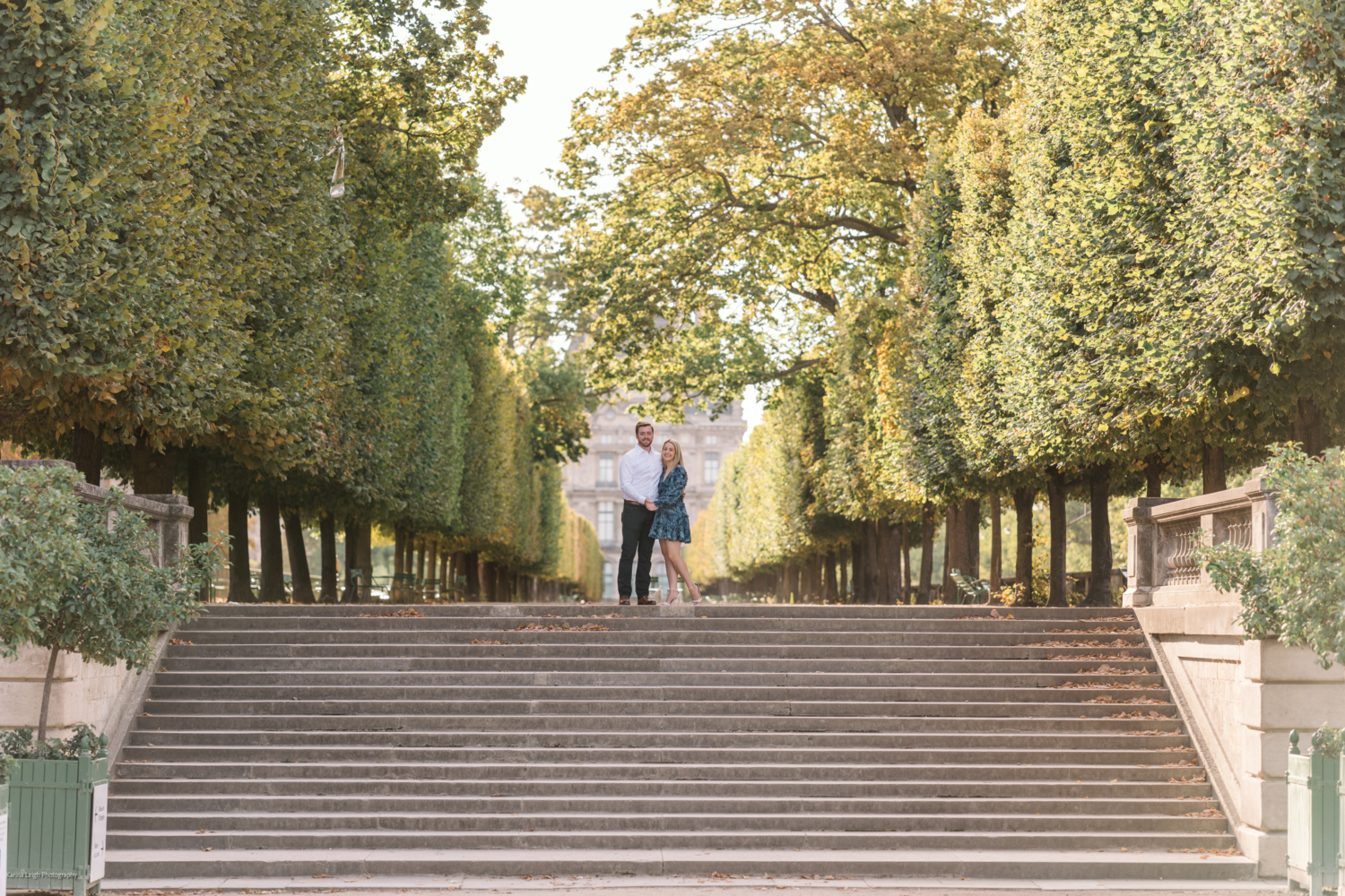 young newly engaged couple couple in the tuileries gardens in paris