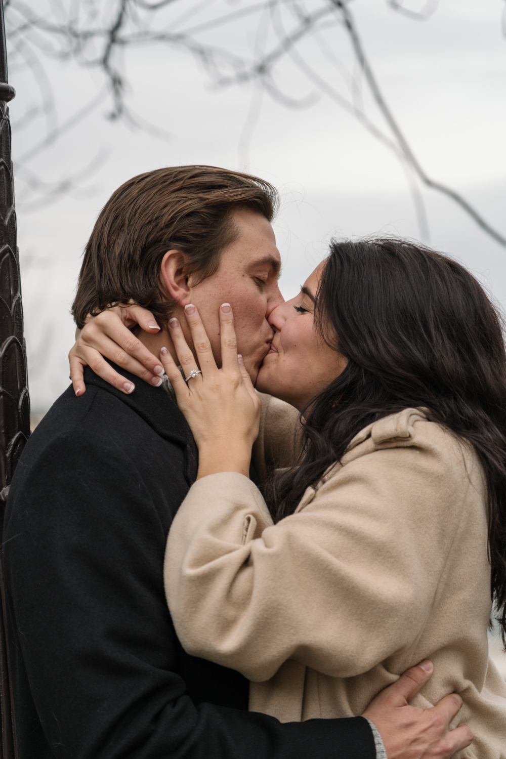 newly engaged couple kiss passionately in paris