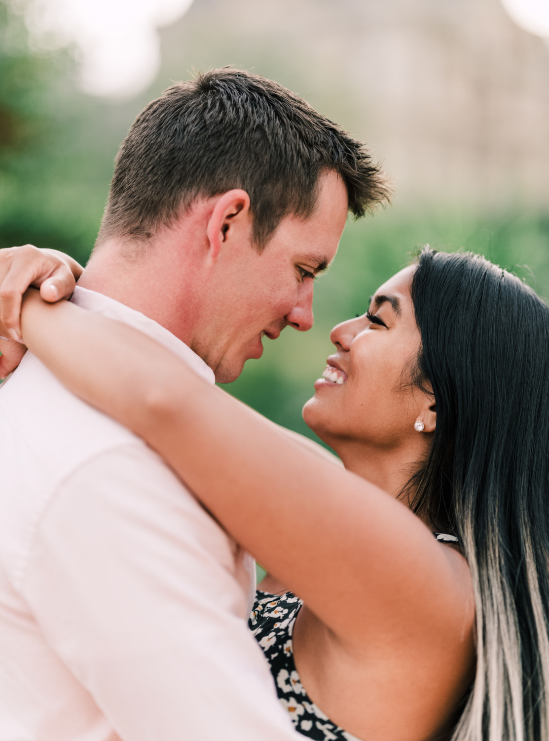 newly engaged couple stare into each other's eyes in paris france