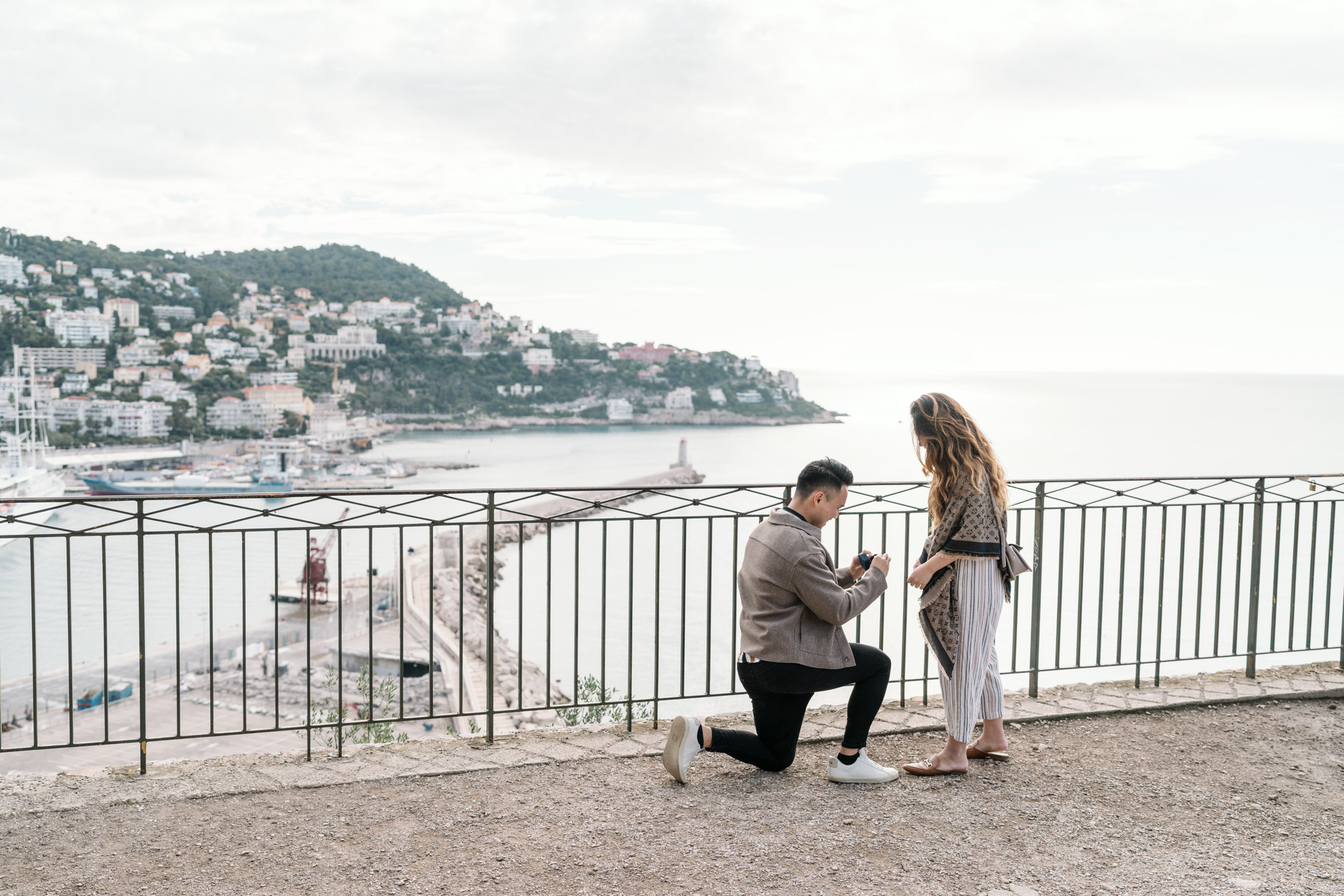 man shows diamond ring to girlfriend as he proposes in nice france