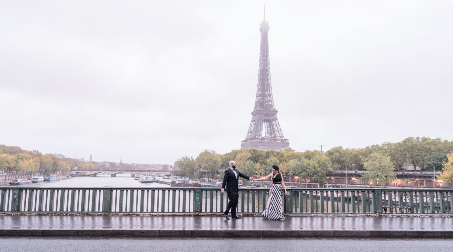 beautiful older couple walk with view of eiffel tower in paris