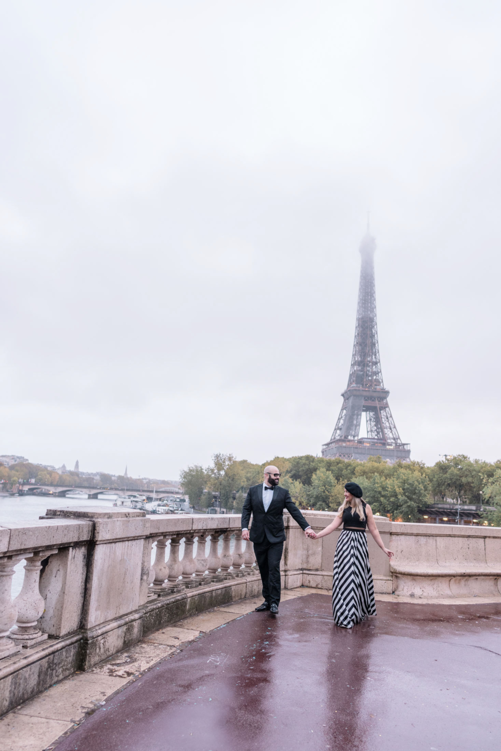 happy mature couple walk with of the eiffel tower in paris