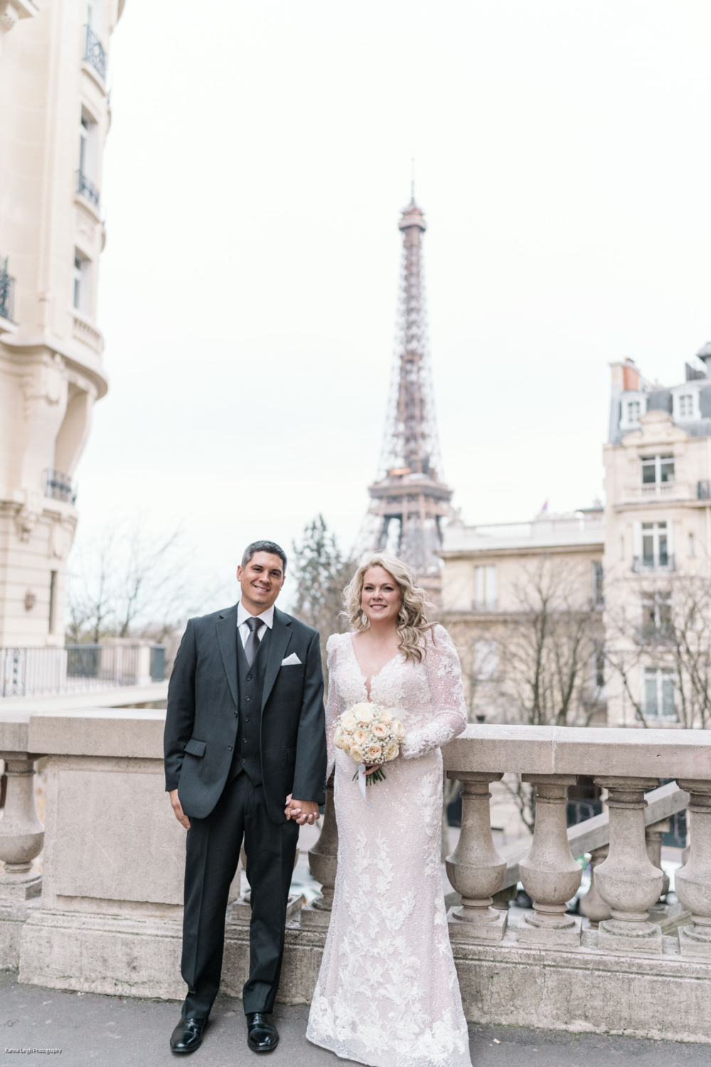 bride and groom pose on their wedding day in paris with the eiffel tower