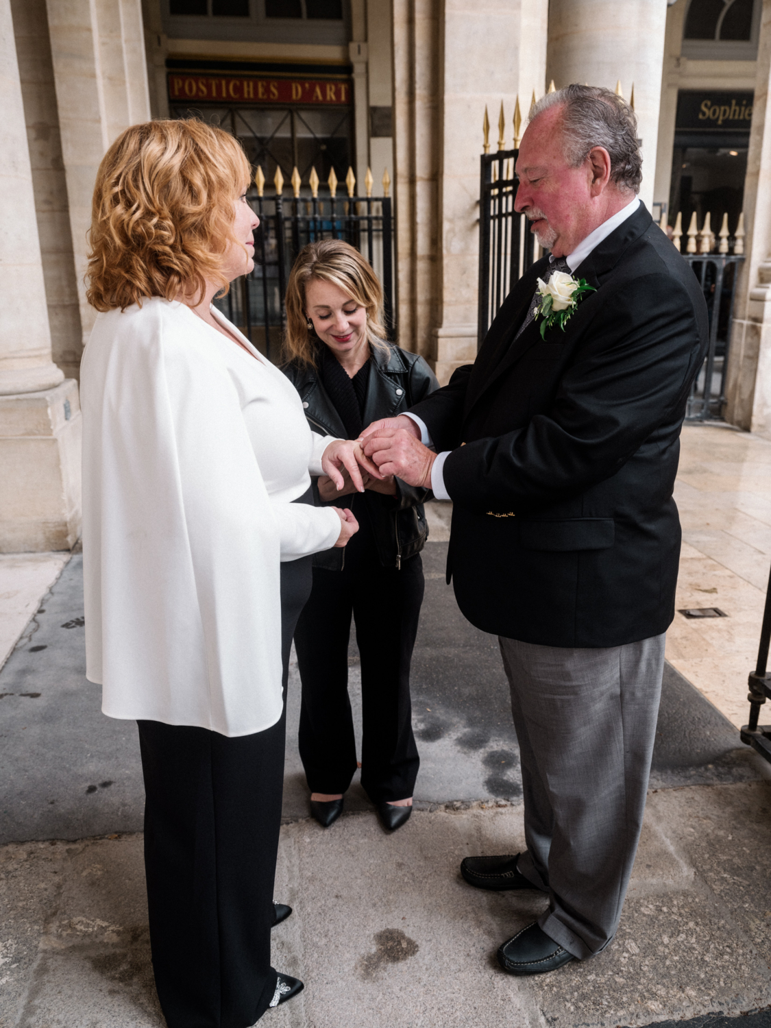 mature newlywed couple exchange rings on their wedding day in paris