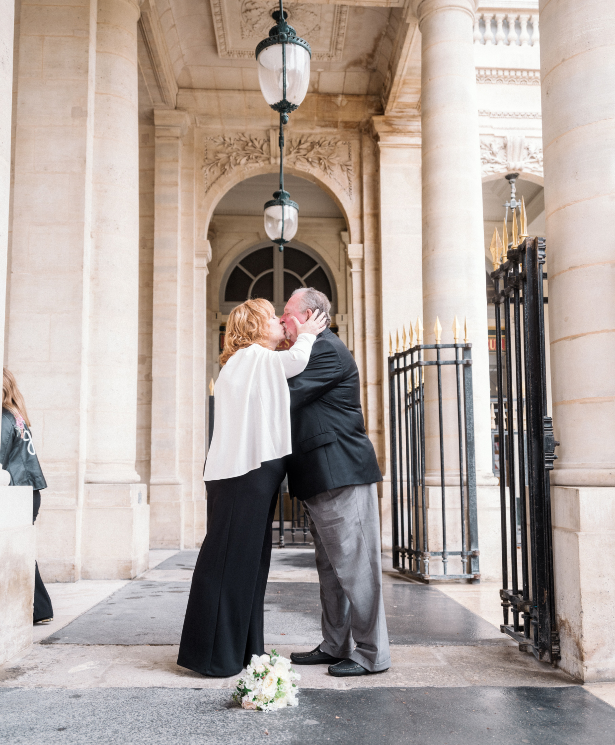 mature newlywed couple kiss on their wedding day in paris