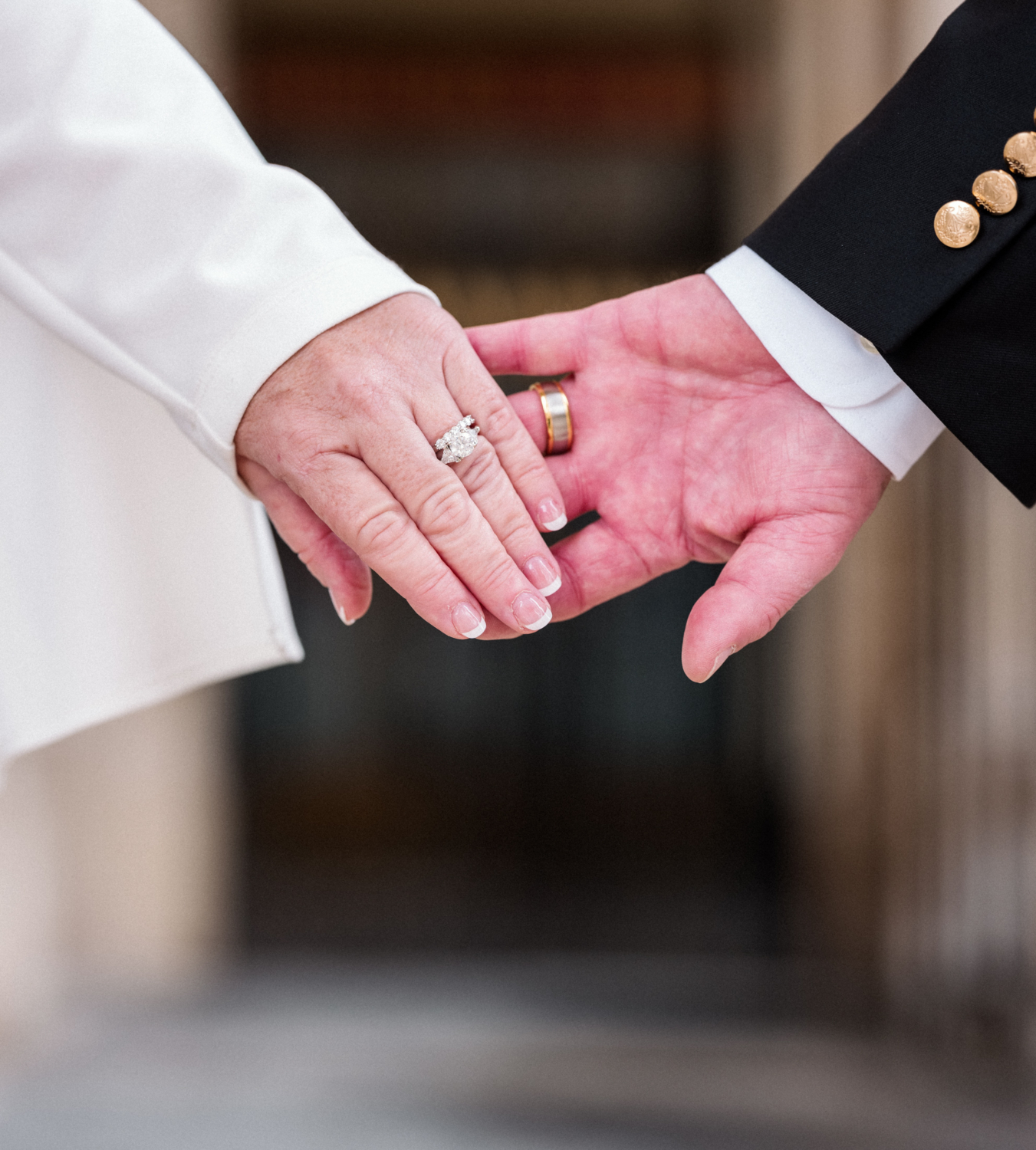 bride and groom show off wedding rings in paris france