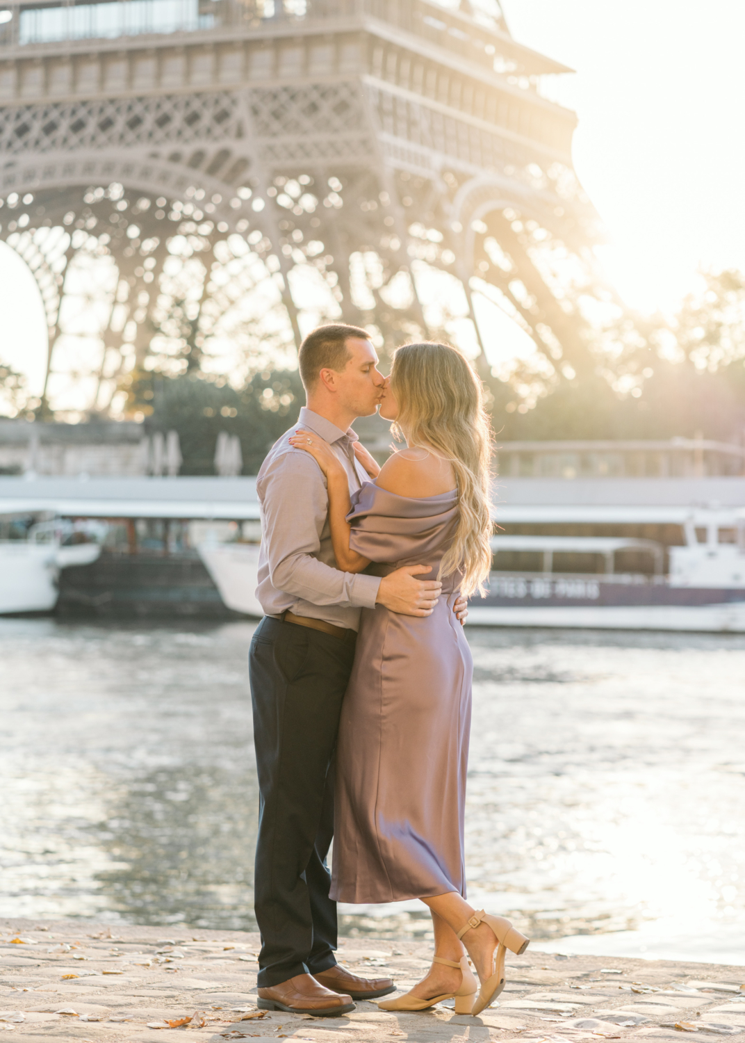 happy married couple kiss in paris at sunrise