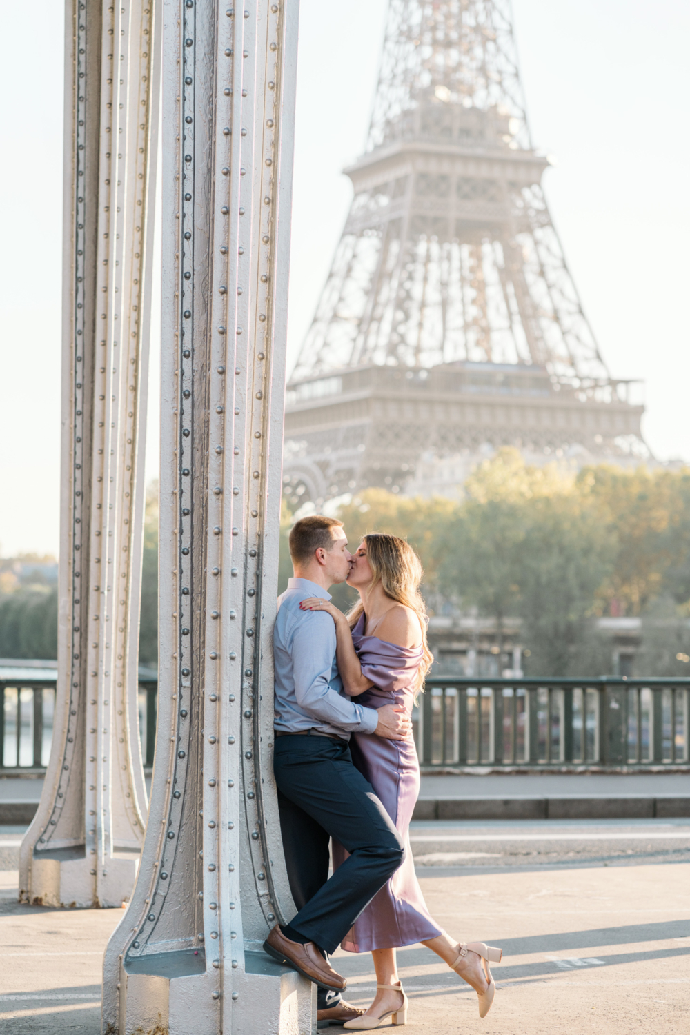 beautiful married couple kiss with view of eiffel toewr in paris