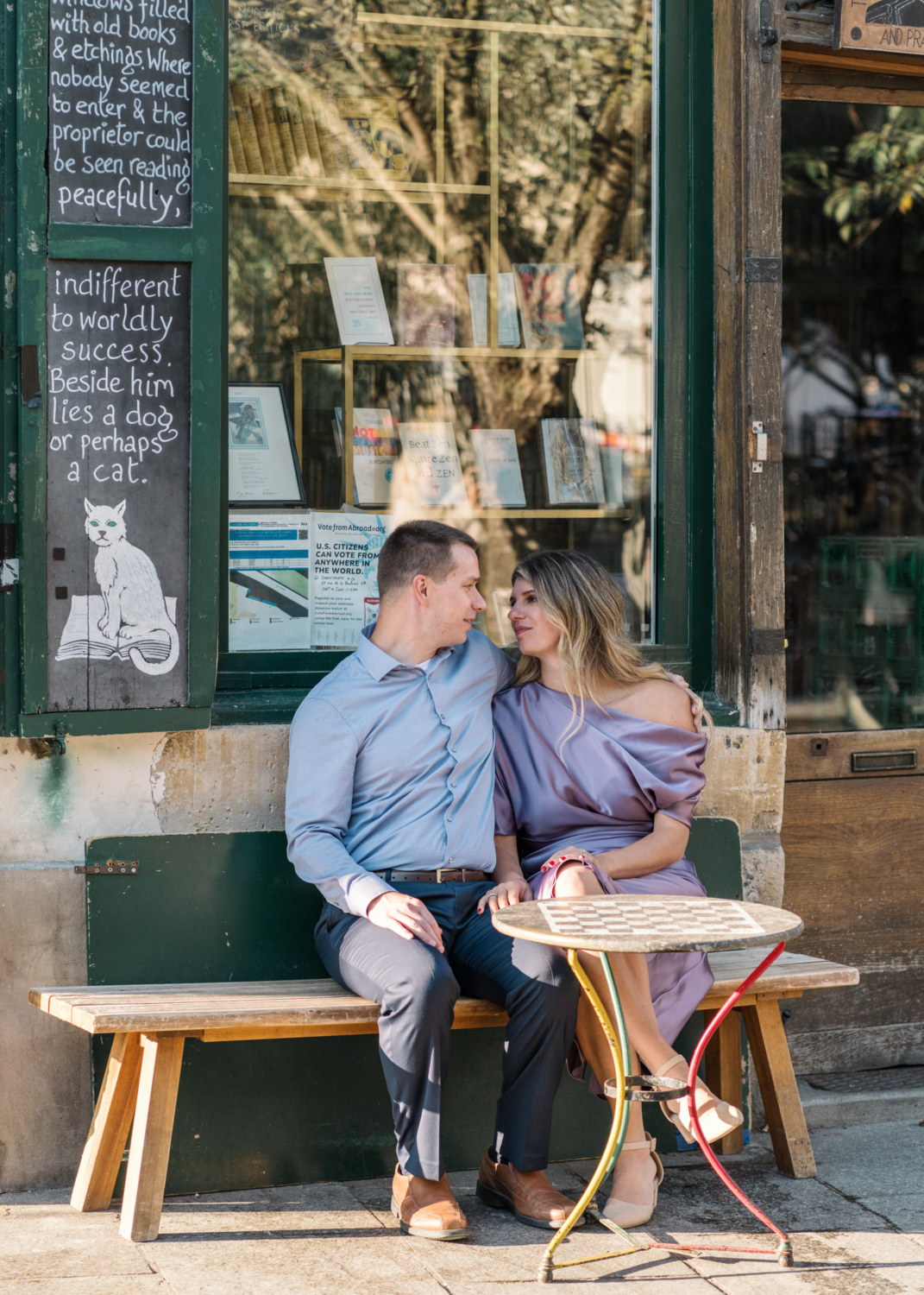 cute couple relax at shakespeare and company cafe in paris