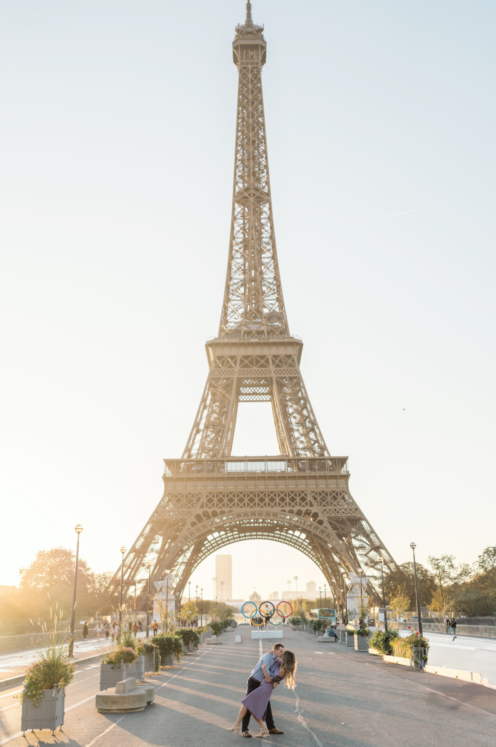 man dips woman with stunning view of the eiffel tower in paris