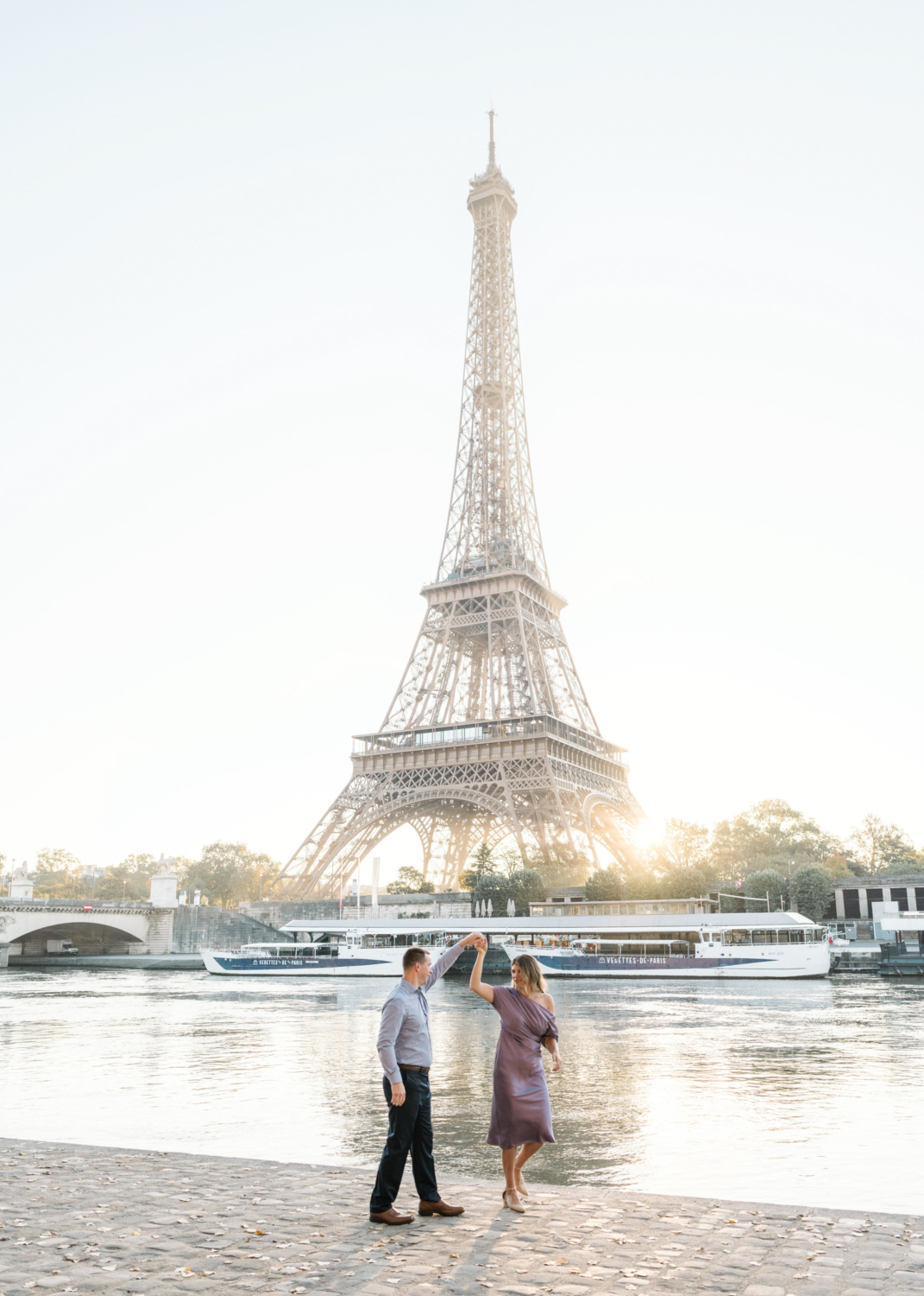 beautiful couple dance with view of eiffel tower in paris