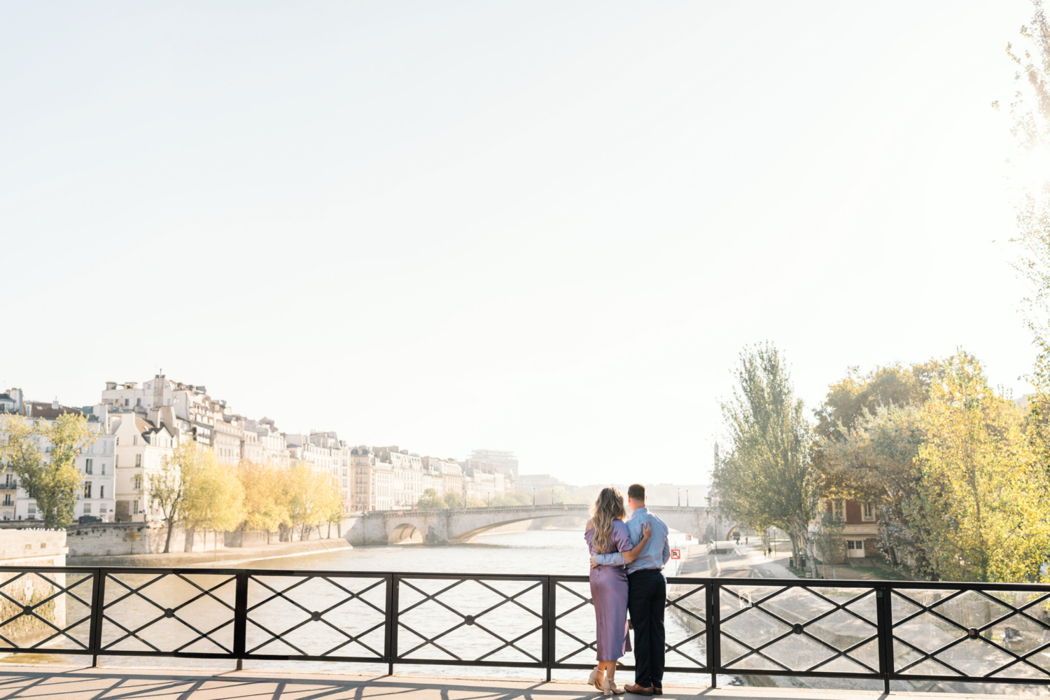 beautiful couple overlook seine river in autumn in paris