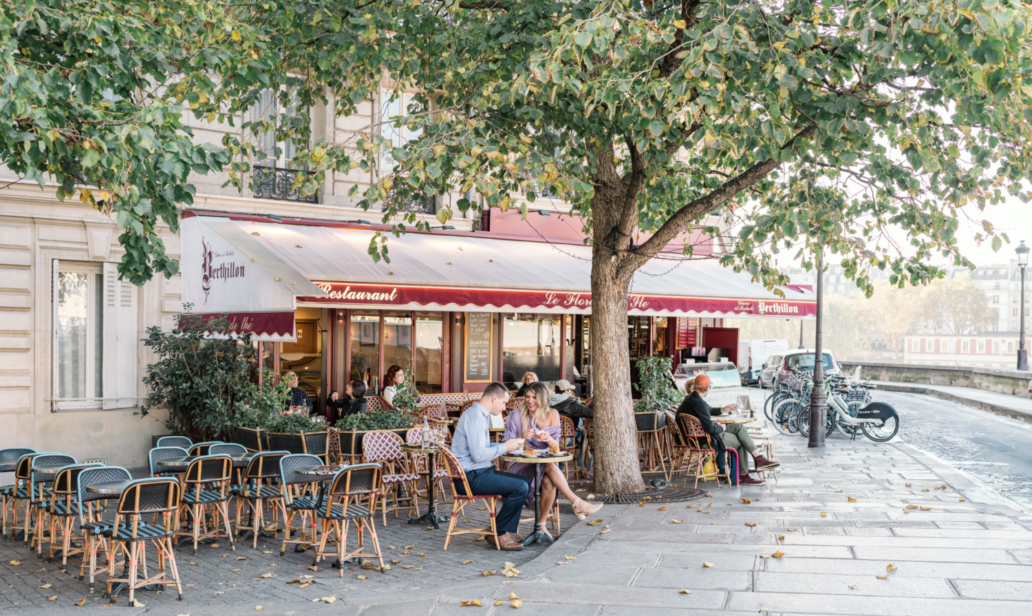 cute couple at cafe on ile st louis in paris