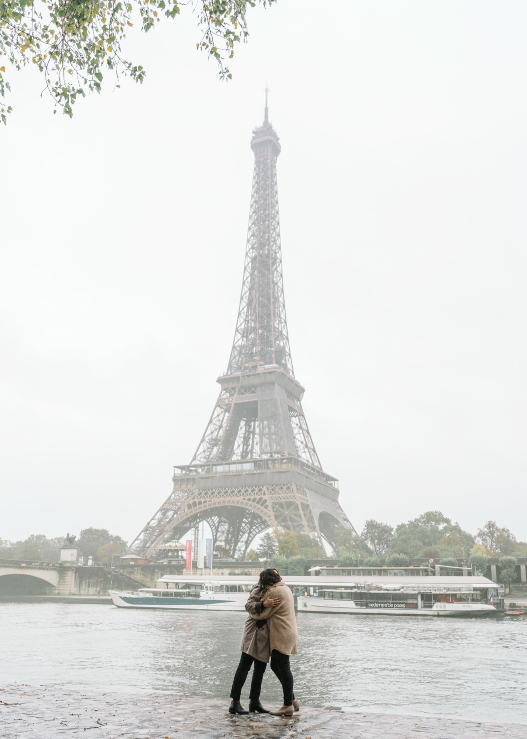 two women hug after their surprise proposal in paris france