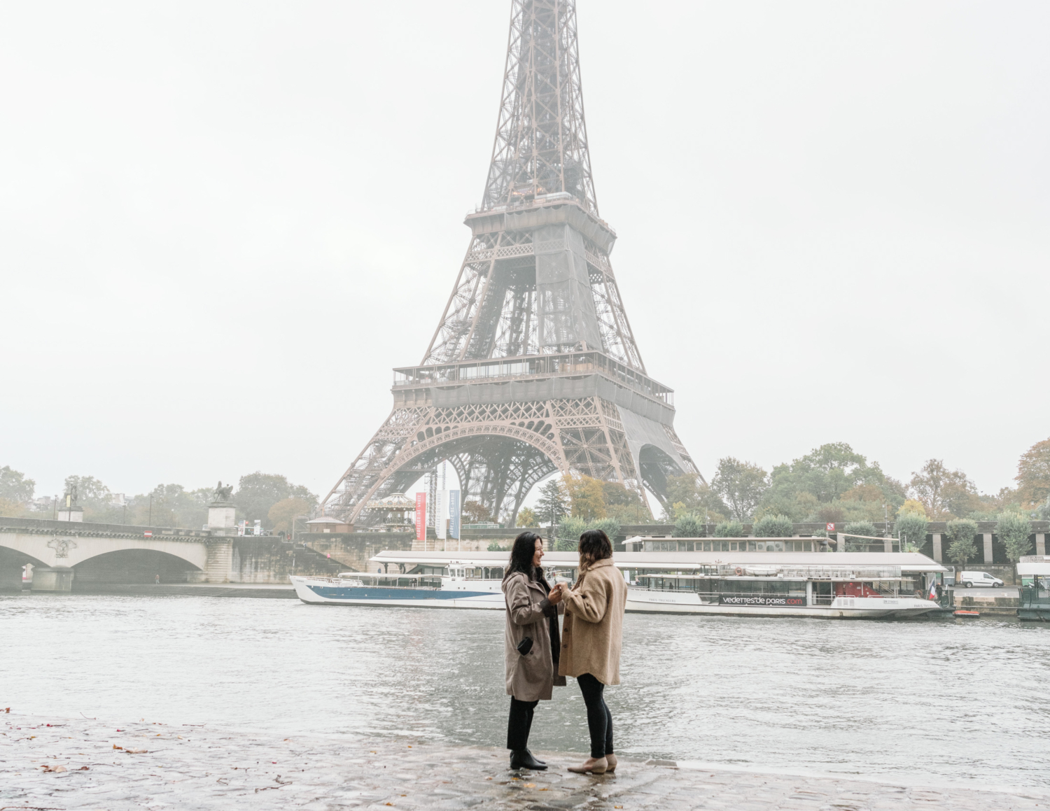 surprise proposal for two women in paris france at the eiffel tower